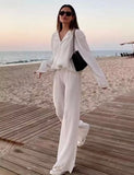 WHITE PLEATED TROUSERS